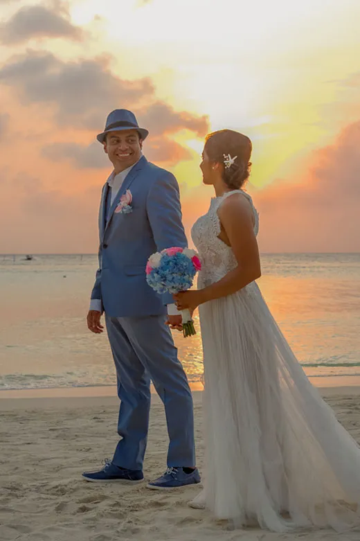 Bride and Groom on the beach at sunset after get married in Roatan