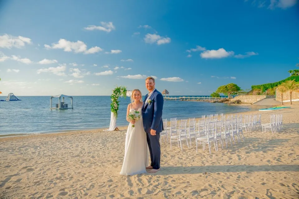 Ben and Natalia on the beach after their ceremony at Pristine Bay, Roatán