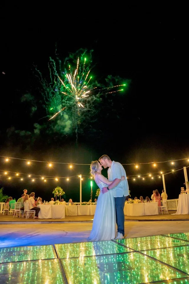 Ben and Natalia under fireworks on the dance floor at Pristine Bay