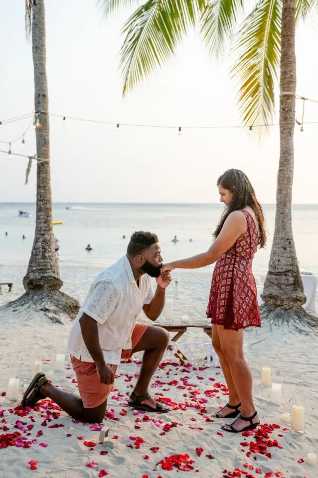 Sunset proposal on one knee on West Bay Beach, Roatán