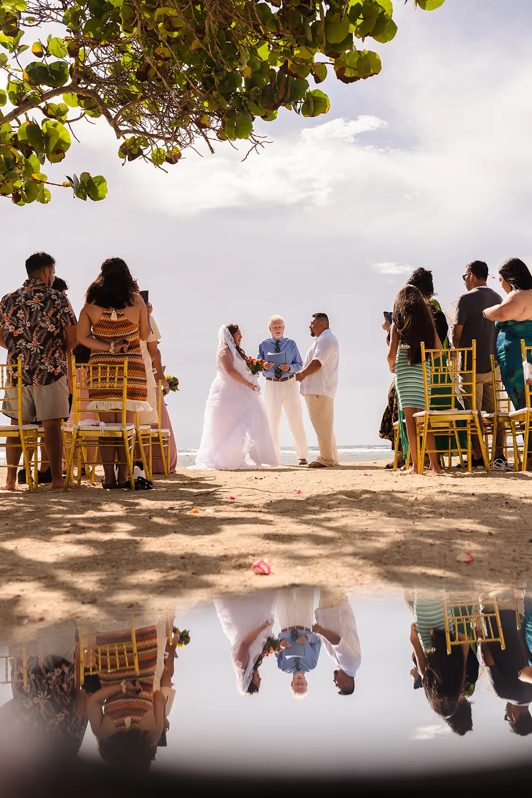 Fabian and Elisa's beach ceremony reflected on the sand at Curación Beach Resort