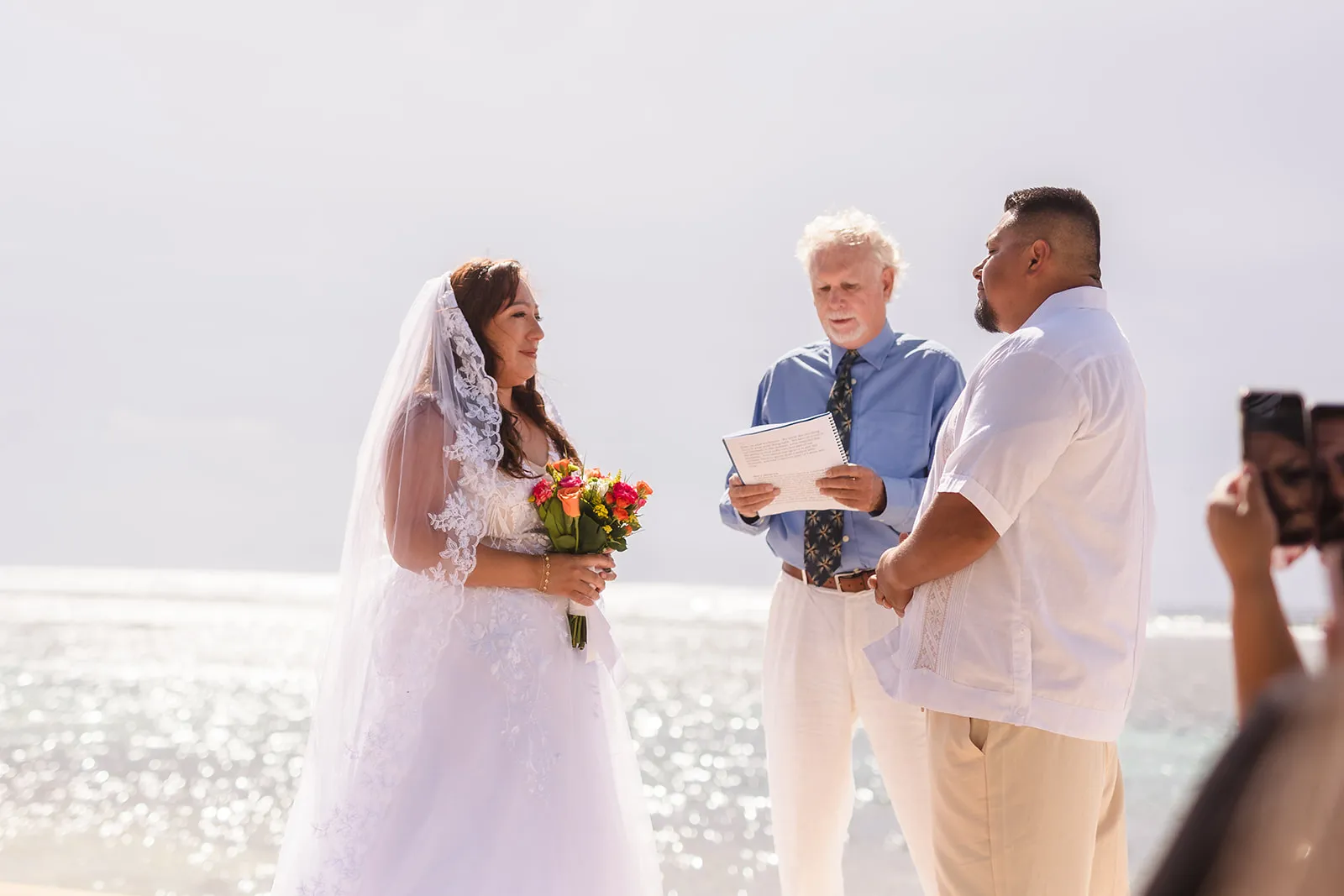 Fabian and Elisa exchanging vows on the beach at Curación Beach Resort
