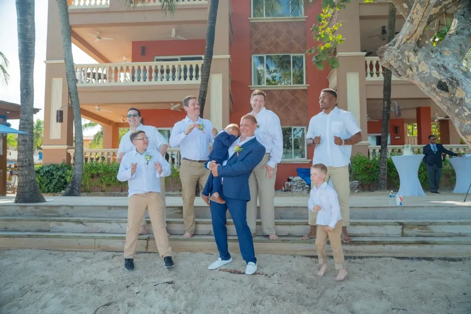Groom with his groomsmen and ring bearers before a cruise wedding in Roatán