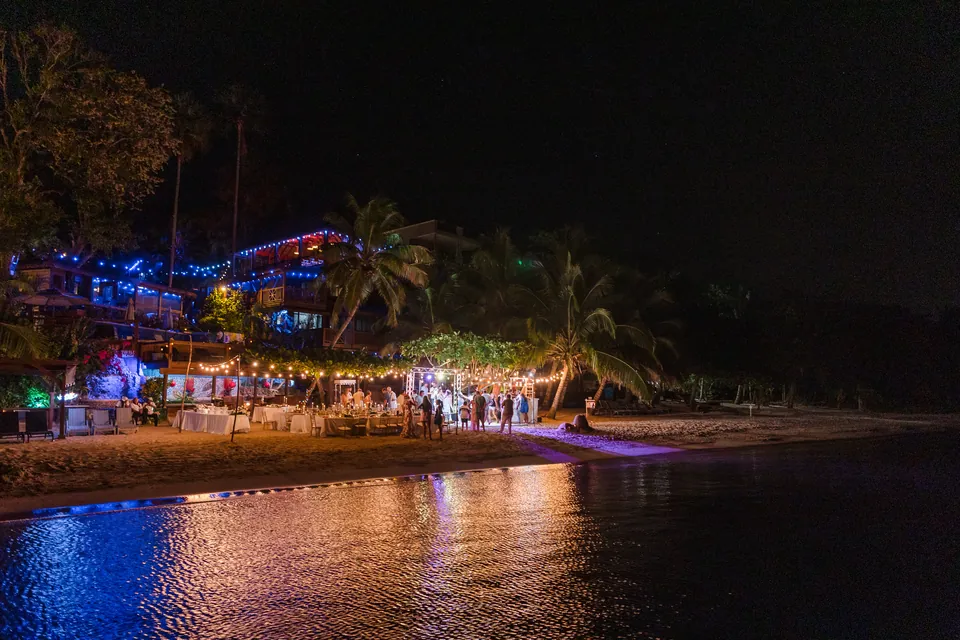 Turtle Beach Roatan resort lit up at night Turtle Beach resort lit up at night for a wedding reception by the sea in Roatán